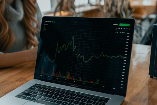 How Does the Stock Market Function Stock Trading - black and silver laptop computer