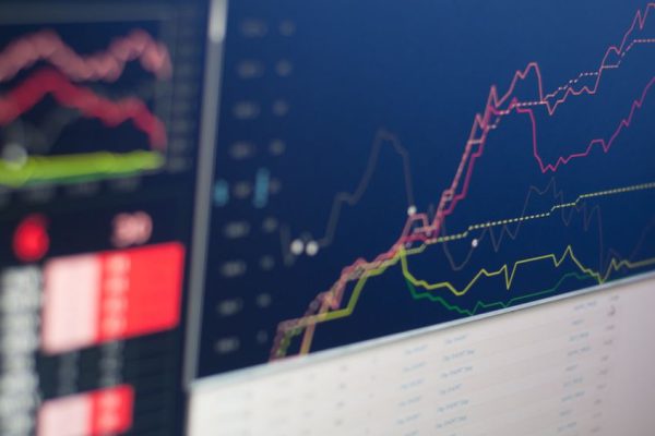 Stock Trading - close-up photo of monitor displaying graph
