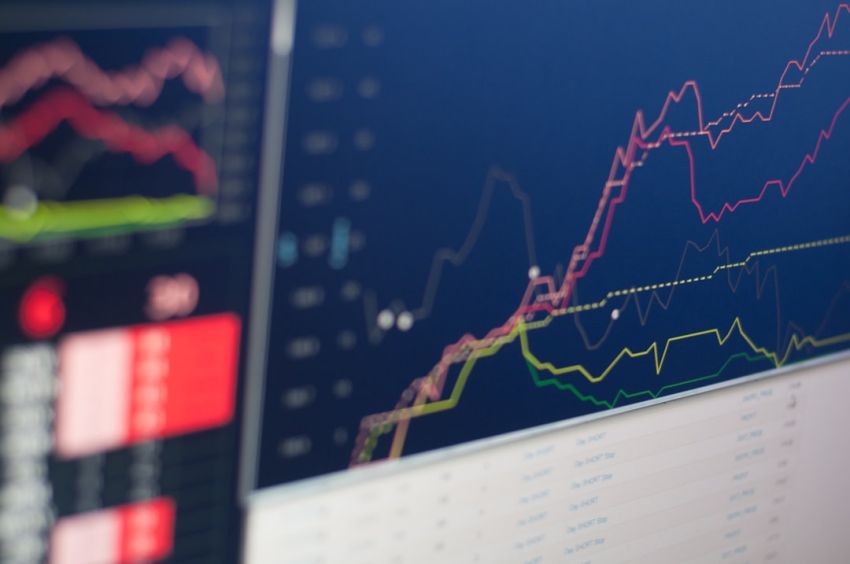 Stock Trading - close-up photo of monitor displaying graph