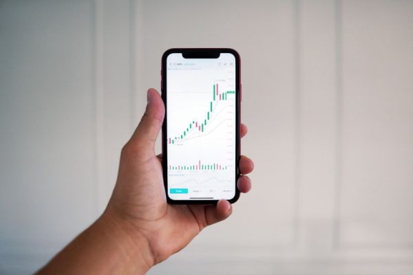 Stock Trading - person holding black android smartphone