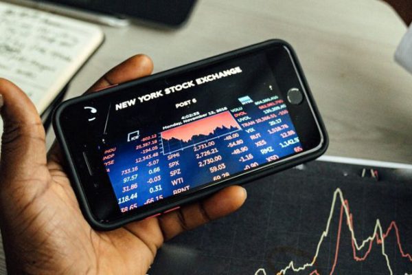 Stock Trading - A Person using a Smartphone