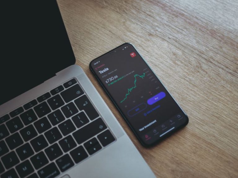 Stock Trading - black android smartphone on macbook pro