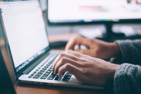 Stock Trading - person using MacBook Pro