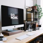 Stock Trading - silver iMac with keyboard and trackpad inside room