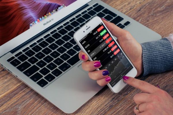 Stock Trading - person holding silver iPhone 6