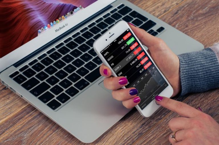 Stock Trading - person holding silver iPhone 6