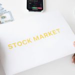 Stock Trading - Photo Of Person Holding White Printer Paper