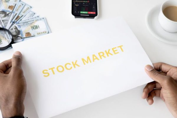 Stock Trading - Photo Of Person Holding White Printer Paper