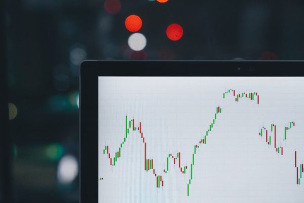 Investment - selective focus photography of graph