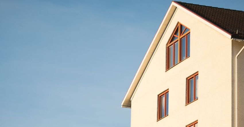 Investment - Beige Concrete House Under Cumulus Cloud