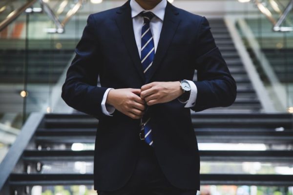 Investment - person standing near the stairs