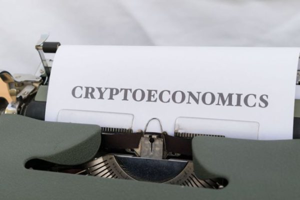 Valuations - A typewriter with a paper that says cryptonomics