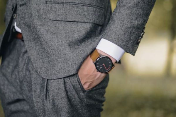 Trends - Man Wearing Watch With Hand on Pocket