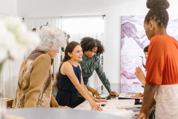 Demand - A Group of Women Having Conversation Inside the Office