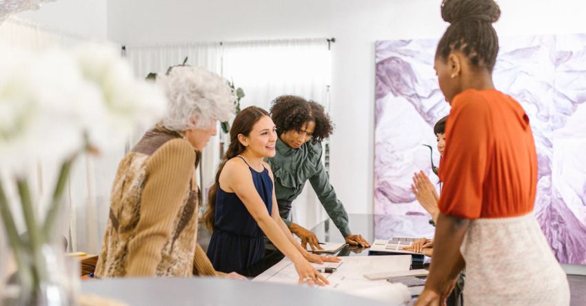 Demand - A Group of Women Having Conversation Inside the Office
