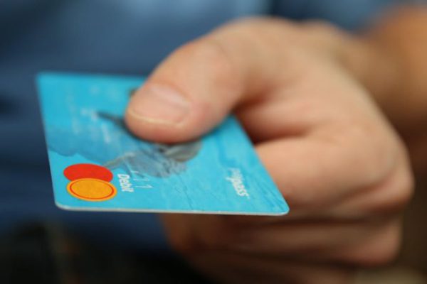 Debt - Person Holding Debit Card