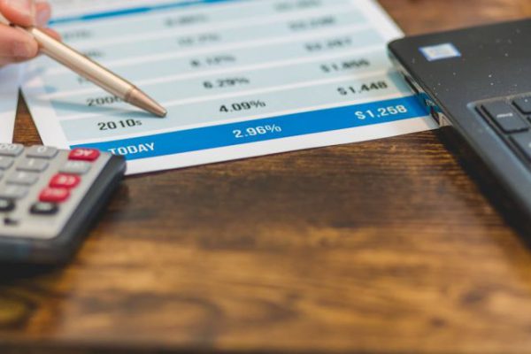 Rates - A Close-Up Shot of an Agent Pointing Rates with a Ballpen