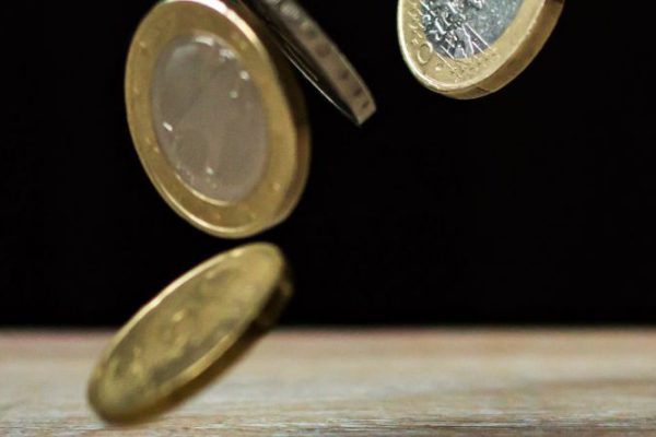 Investments - Coins on Brown Wood