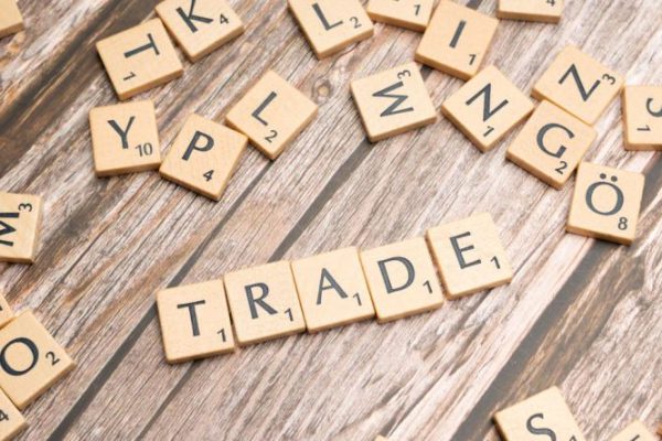 Tariffs - Trade and trade related words on wooden table