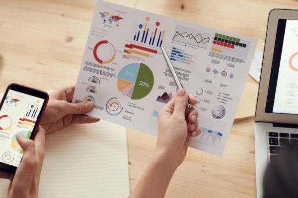Charts - Colleagues Looking at Survey Sheet