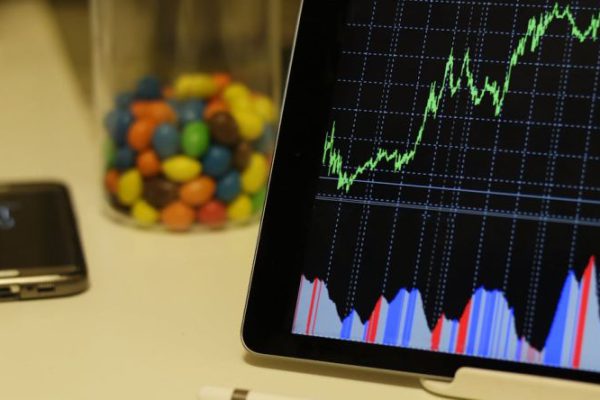 Trading - White Android Tablet Turned on Displaying a Graph