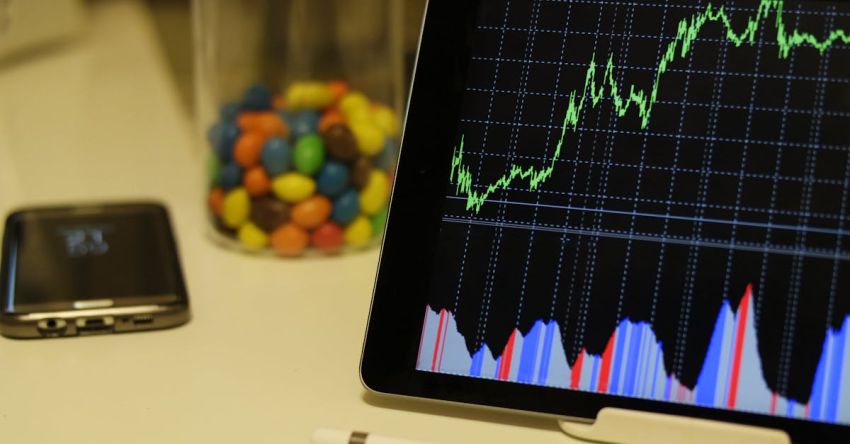 Trading - White Android Tablet Turned on Displaying a Graph